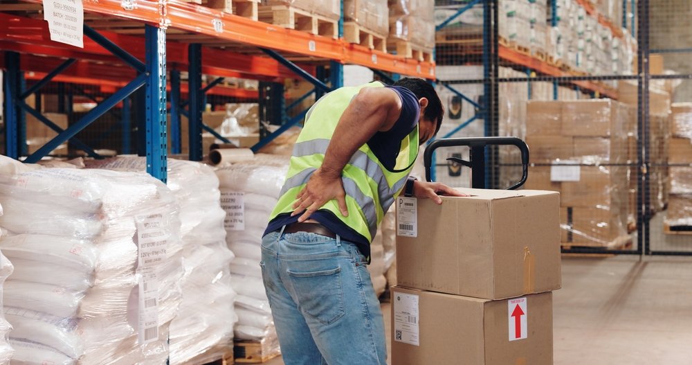 Pallet,Truck,,Man,And,Back,Pain,In,Warehouse,With,Transport, work injury tyrone pa
